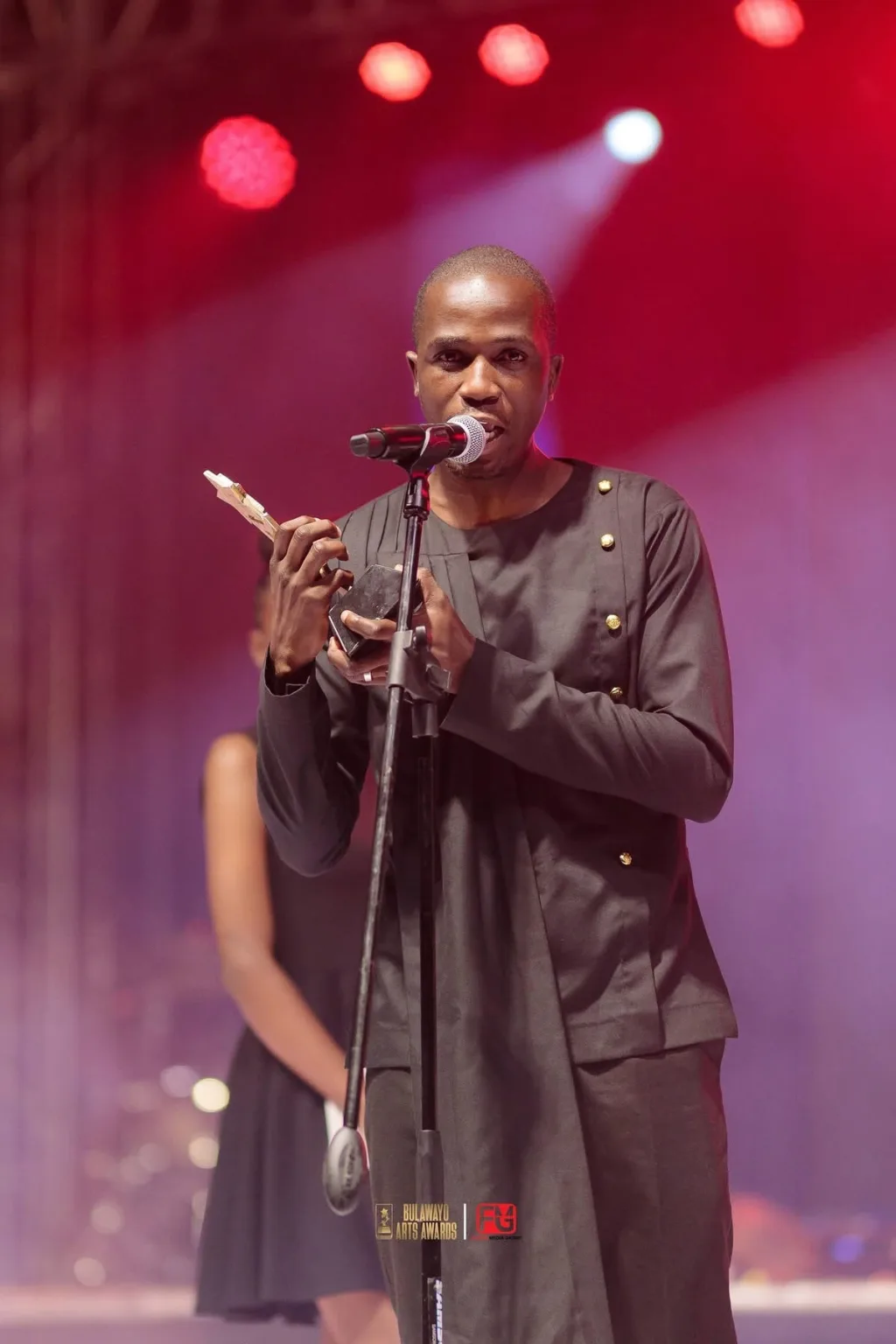 A media award winner on stage