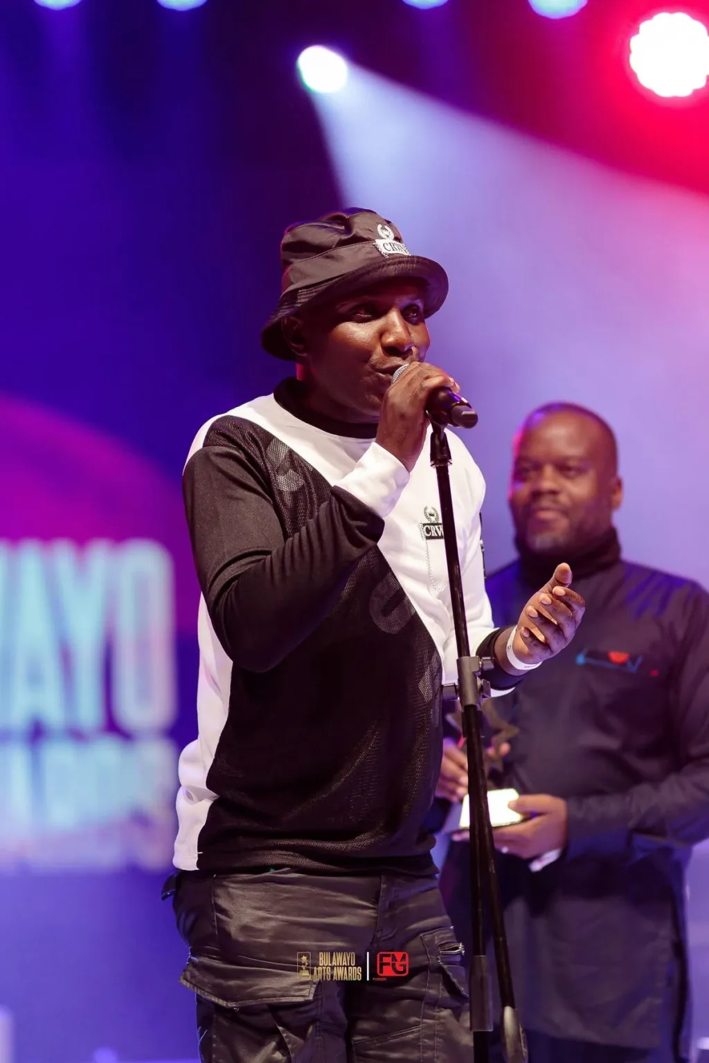 A spoken word performer at the microphone